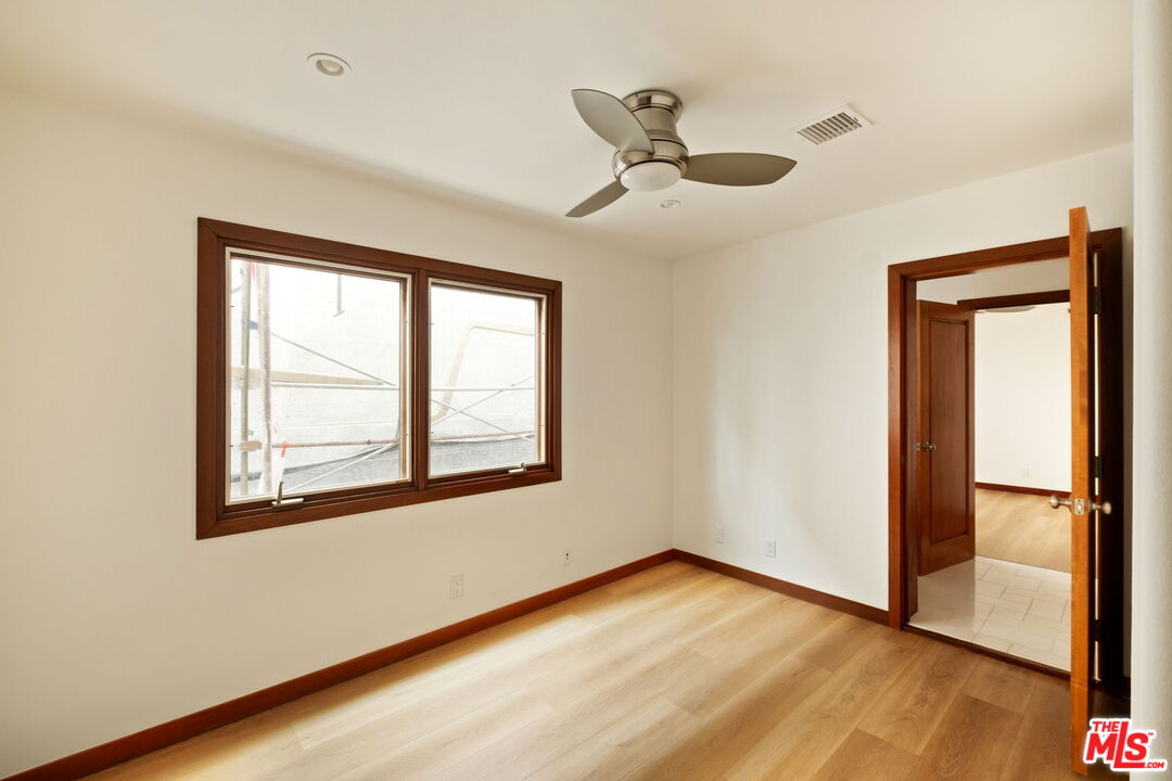 2325 Abbot Kinney Boulevard Venice, CA 90291 - Photo 23 of 32 a view of an empty room with wooden floor and a window
