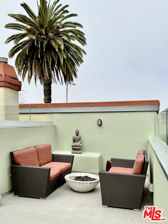2325 Abbot Kinney Boulevard Venice, CA 90291 - Photo 30 of 32 a living room with furniture and a potted plant