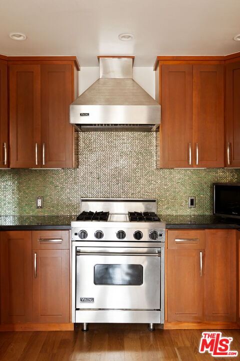 2325 Abbot Kinney Boulevard Venice, CA 90291 - Photo 8 of 32 a kitchen with stainless steel appliances granite countertop a stove and a microwave