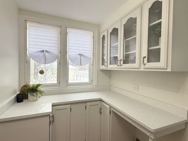 a kitchen with stainless steel appliances a stove a microwave and cabinets