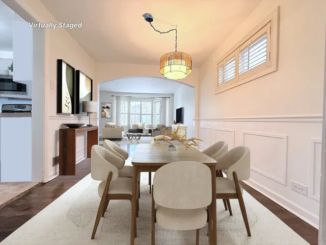 a view of empty room with wooden floor and window