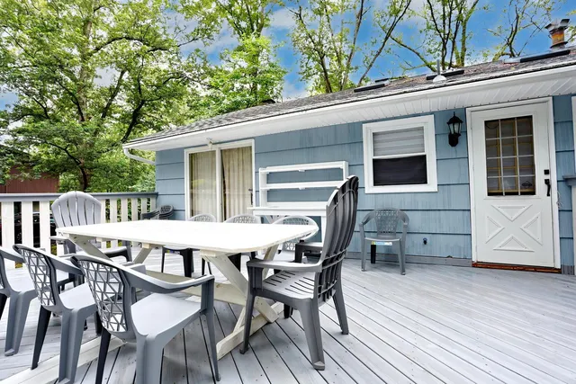 a view of a house with a patio and wooden flooring
