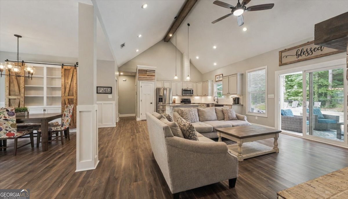 683 Teagle Road Forsyth, GA 31029 - Photo 11 of 50 a living room with furniture and a large window