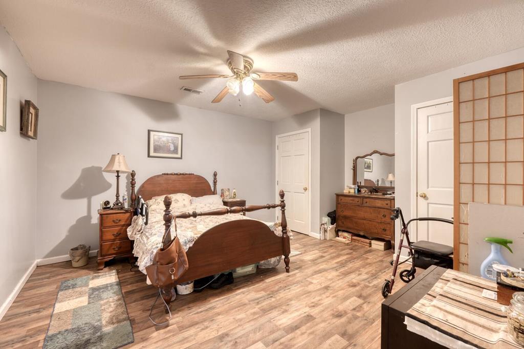 105 Liberty Road Murphy, NC 28906 - Photo 44 of 53 a bedroom with a bed and wooden floor