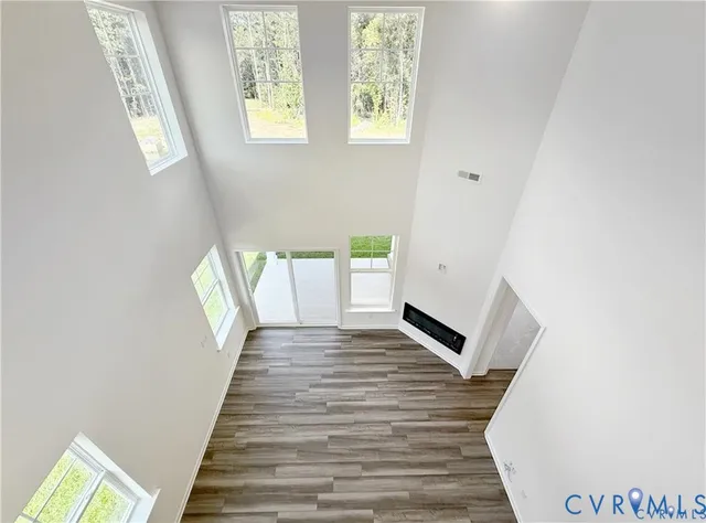 a view of an entryway with wooden floor