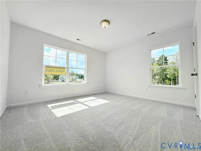 an empty room with windows