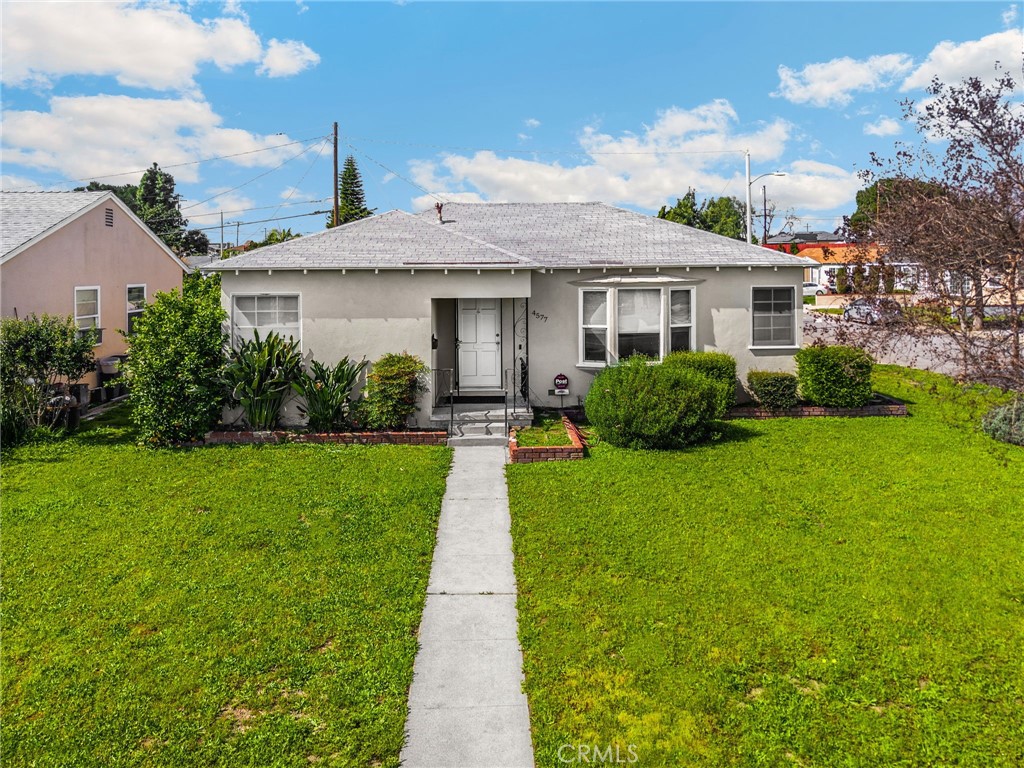 4577 Ranger Avenue El Monte, CA 91731 - Photo 1 of 25 a front view of a house with a yard and potted plants