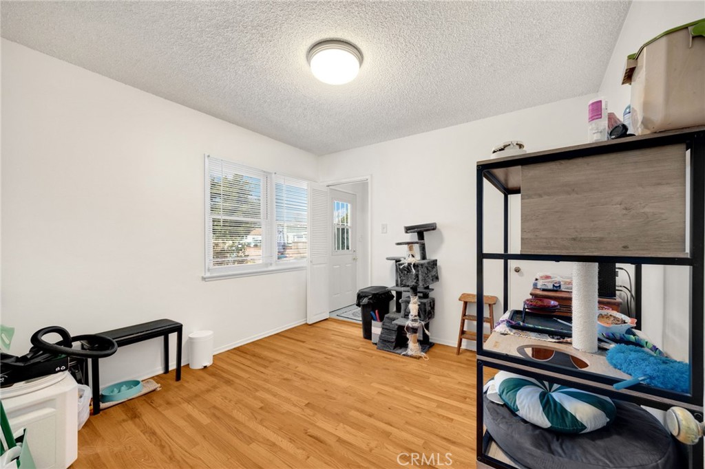 4577 Ranger Avenue El Monte, CA 91731 - Photo 22 of 25 a bedroom with furniture and a flat screen tv