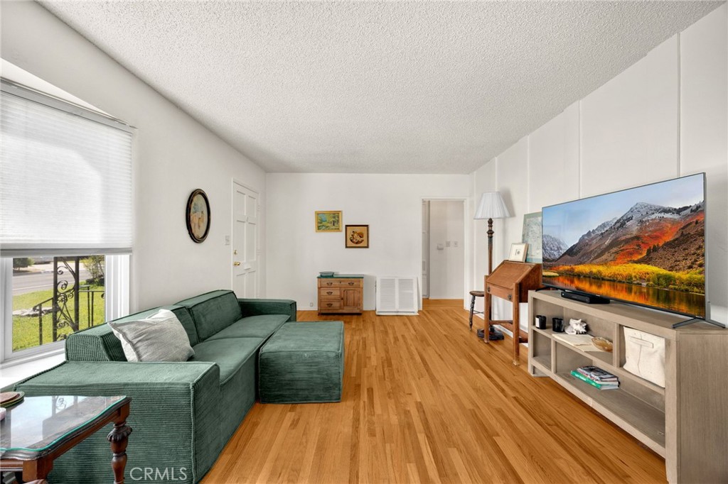 4577 Ranger Avenue El Monte, CA 91731 - Photo 5 of 25 a living room with furniture and a flat screen tv