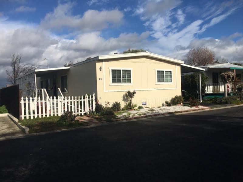 17 Del Rio Pittsburg, CA 94565 - Photo 1 of 4 a front view of a house with a garden