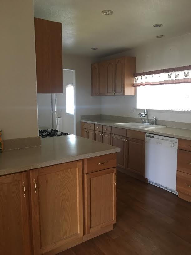 17 Del Rio Pittsburg, CA 94565 - Photo 2 of 4 a kitchen with stainless steel appliances granite countertop a sink a stove and a refrigerator