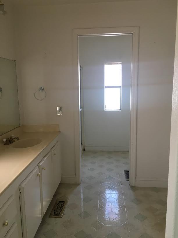 17 Del Rio Pittsburg, CA 94565 - Photo 4 of 4 a bathroom with a sink and a mirror