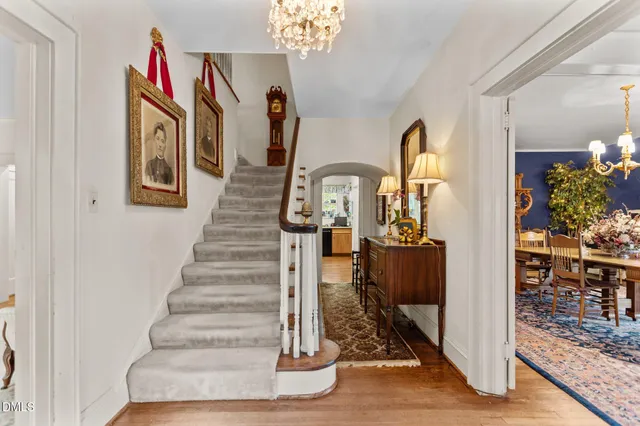 a view of entryway and hall with wooden floor