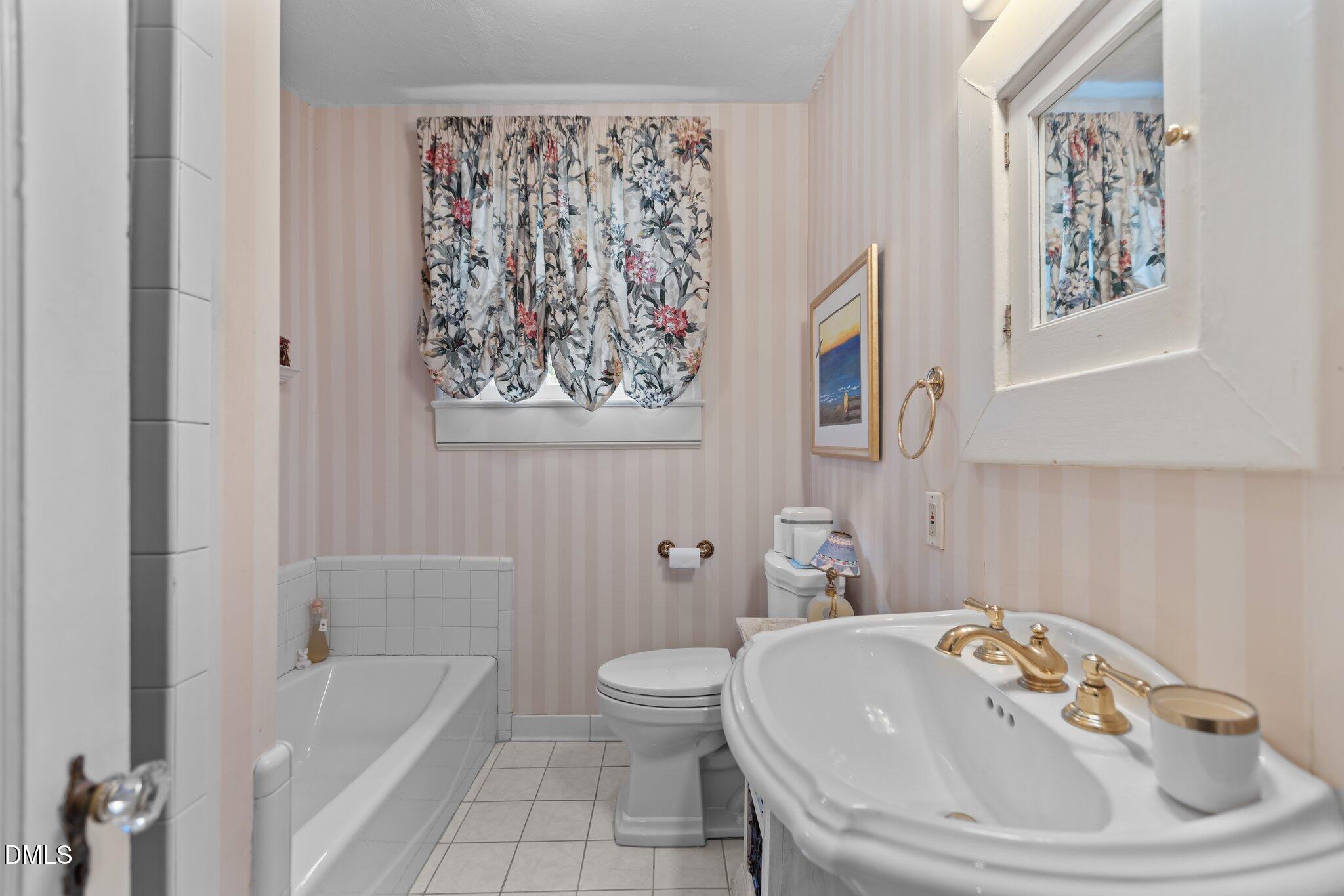 3724 Hope Valley Road Durham, NC 27707 - Photo 23 of 55 a bathroom with a sink and a bathtub