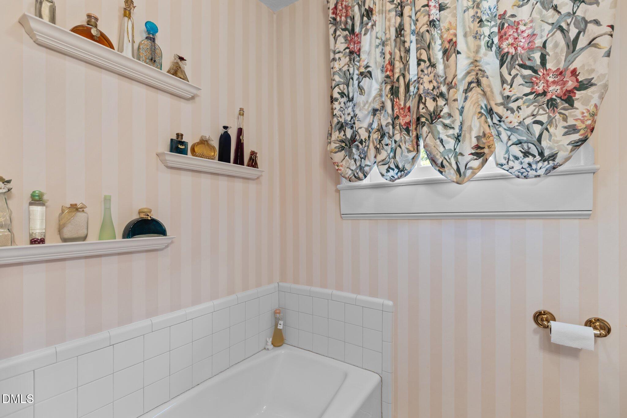 3724 Hope Valley Road Durham, NC 27707 - Photo 24 of 55 a bathroom with a bathtub and sink