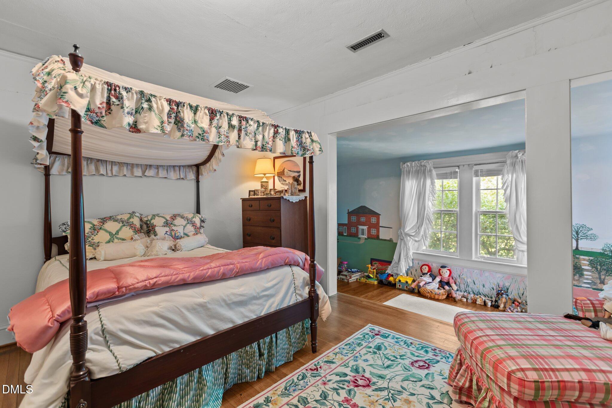 3724 Hope Valley Road Durham, NC 27707 - Photo 26 of 55 a bedroom with bed and a large windows
