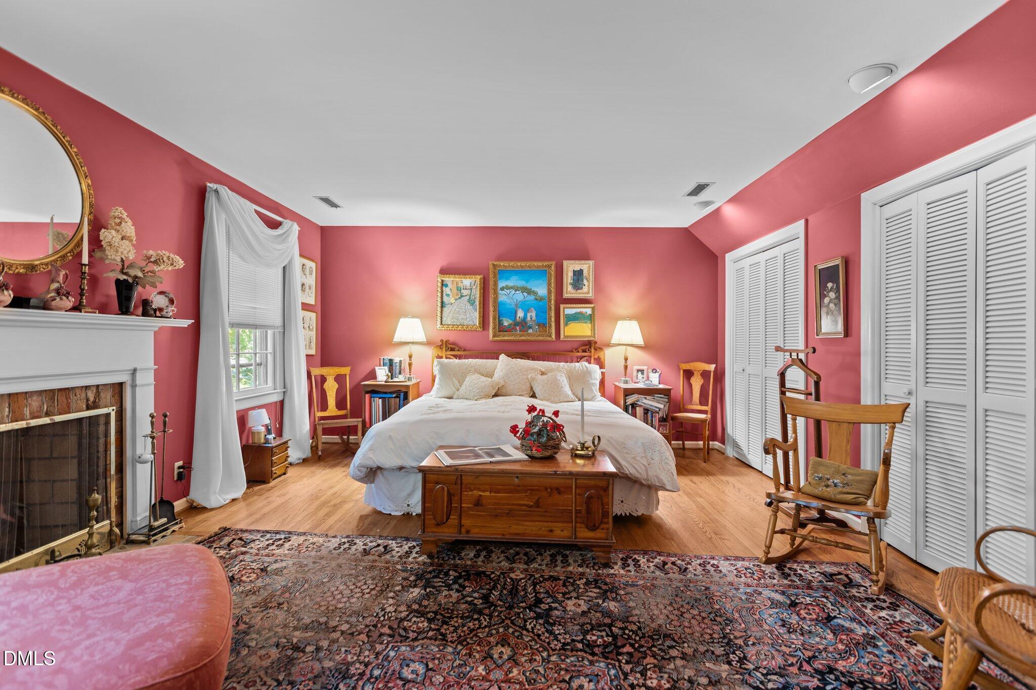 3724 Hope Valley Road Durham, NC 27707 - Photo 32 of 55 a living room with furniture a flat screen tv and a fireplace