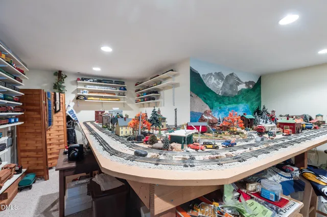 an aerial view of a house with a yard and tree s