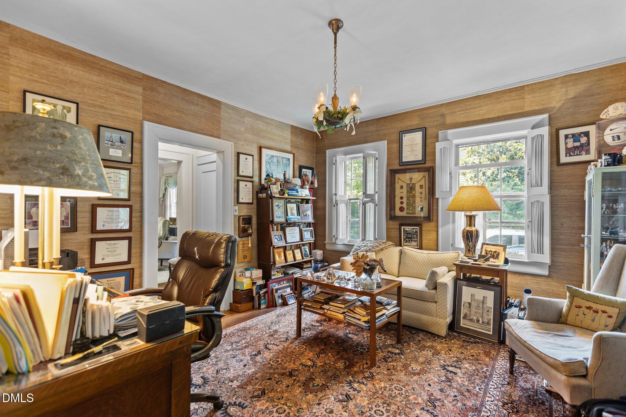 3724 Hope Valley Road Durham, NC 27707 - Photo 6 of 55 a living room with furniture fireplace and a large window