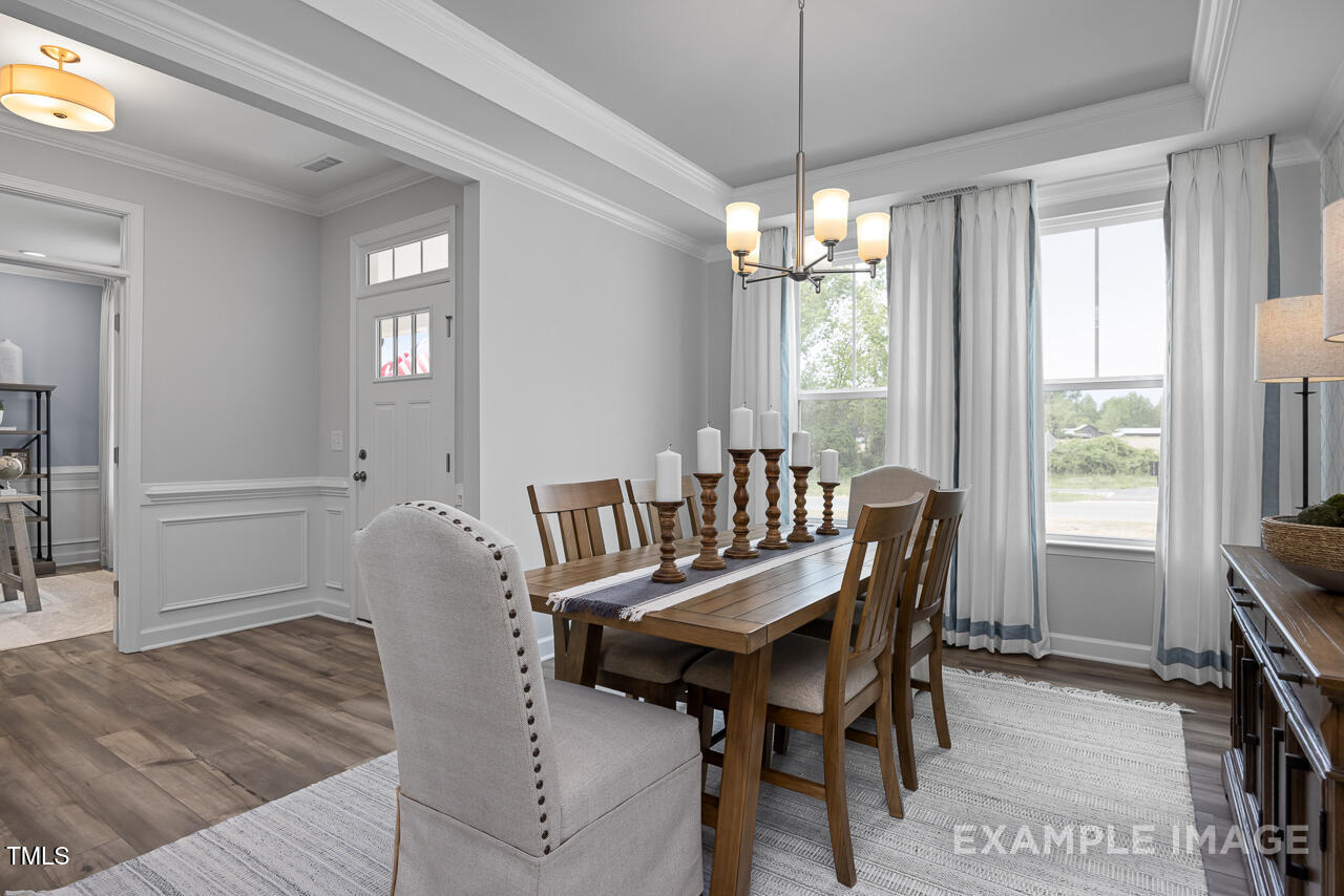 297 Crop Road Angier, NC 27501 - Photo 4 of 23 a view of a dining room with furniture window and outside view
