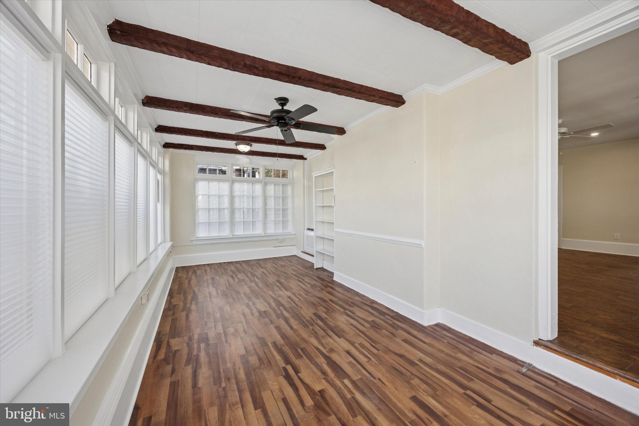 21 South Clinton Street, Unit 1 Doylestown, PA 18901 - Photo 12 of 14 Bright, airy space with charming beams.