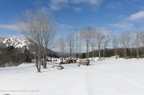 a view of snow on the side of a road