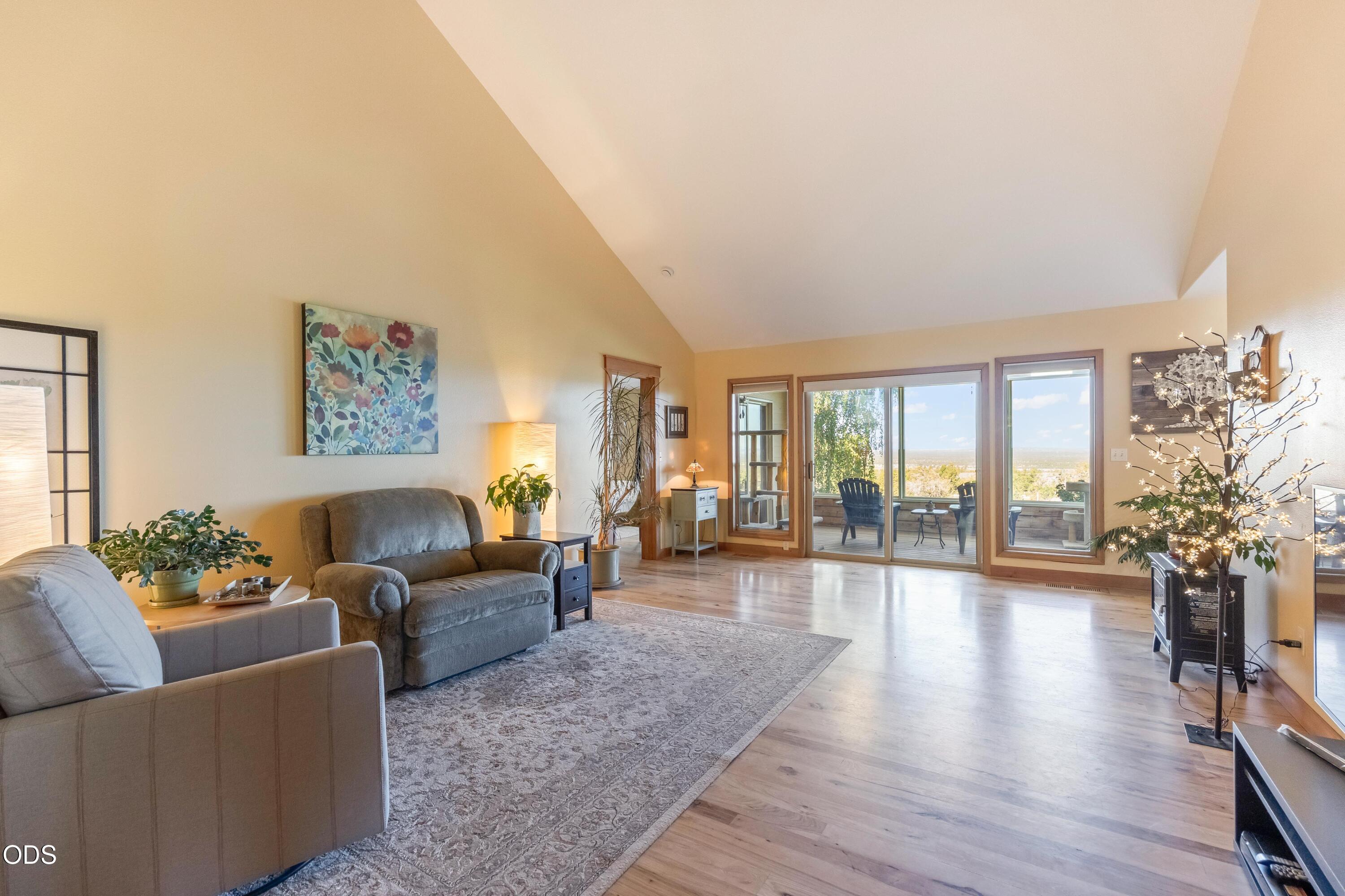 13753 South Sego Lily Road Powell Butte, OR 97753 - Photo 4 of 46 a living room with furniture and a large window