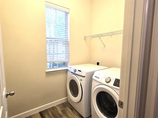a view of storage and utility room with washer and dryer