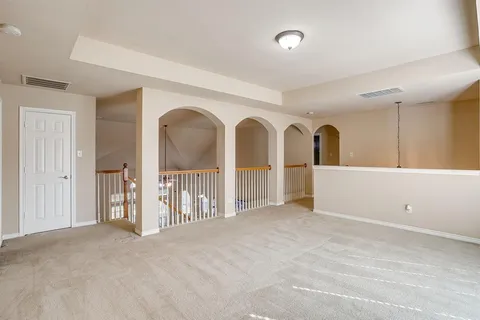 a bathroom with a sink mirror and vanity
