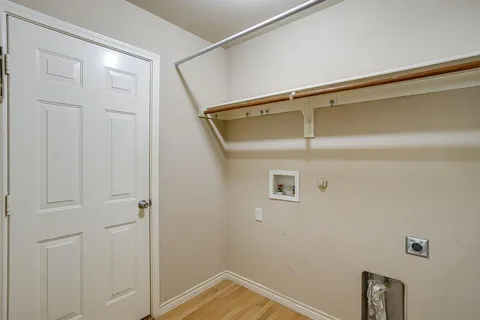 a view of an empty room with windows