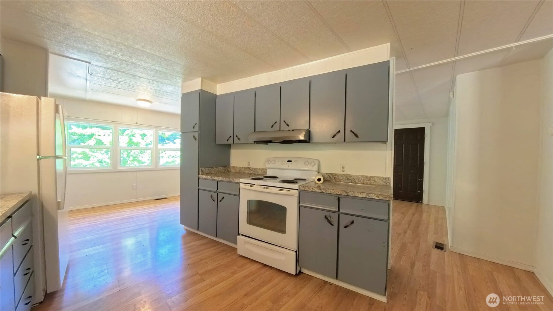 650 North Lake Cushman Road Hoodsport, WA 98548 - Photo 5 of 15 a kitchen with stainless steel appliances granite countertop a stove and a refrigerator