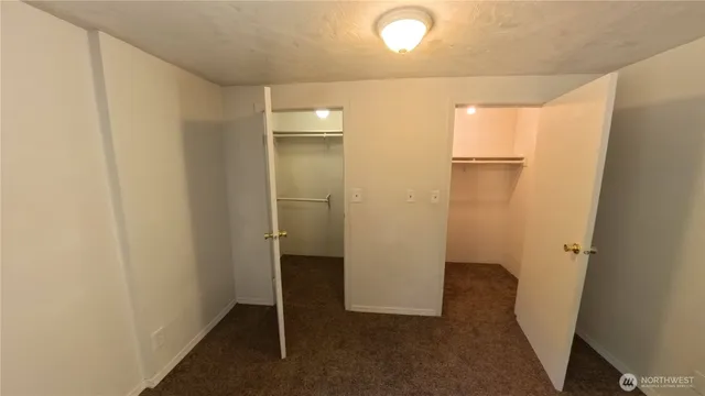 a view of hallway with closet