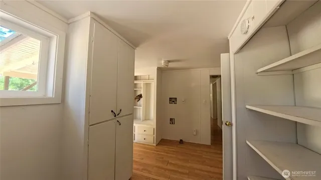 a view of bathroom with a shower and a room