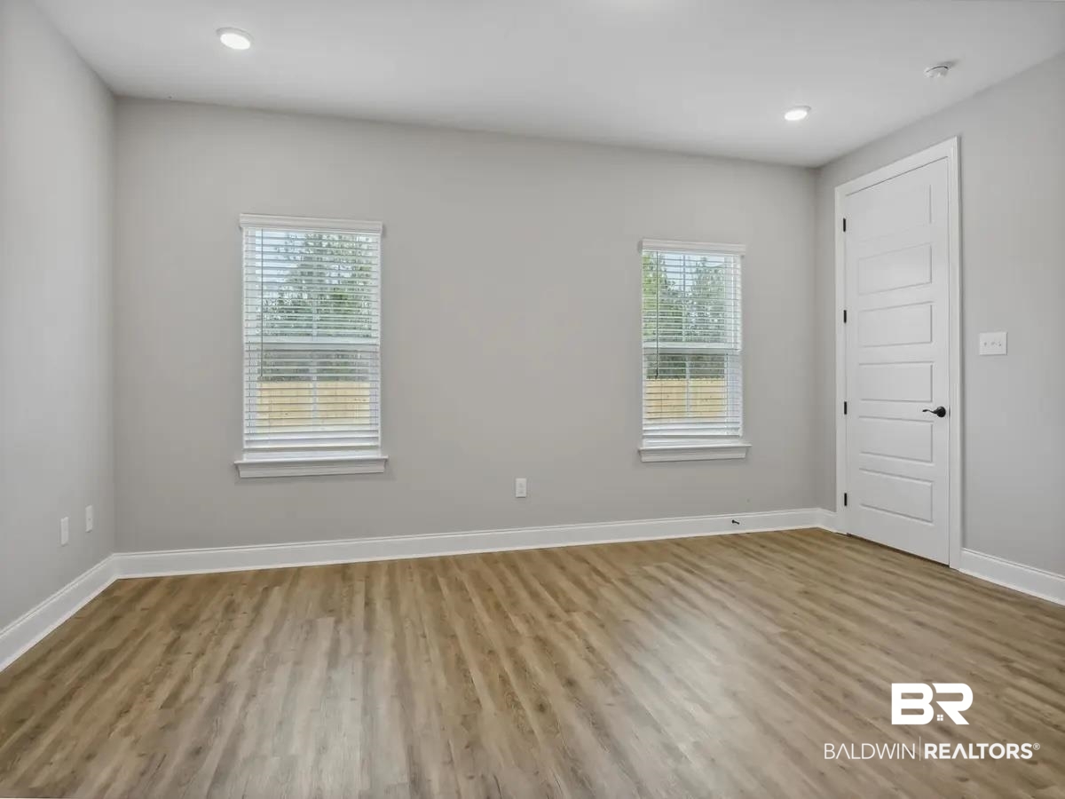 10174 Grady Lane Mobile, AL 36695 - Photo 7 of 14 Spare room featuring wood finished floors and recessed lighting