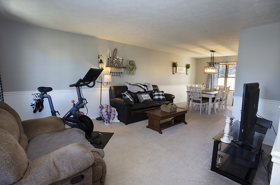 709 Landau Lane Normal, IL 61761 - Photo 12 of 44 a living room with furniture and a flat screen tv