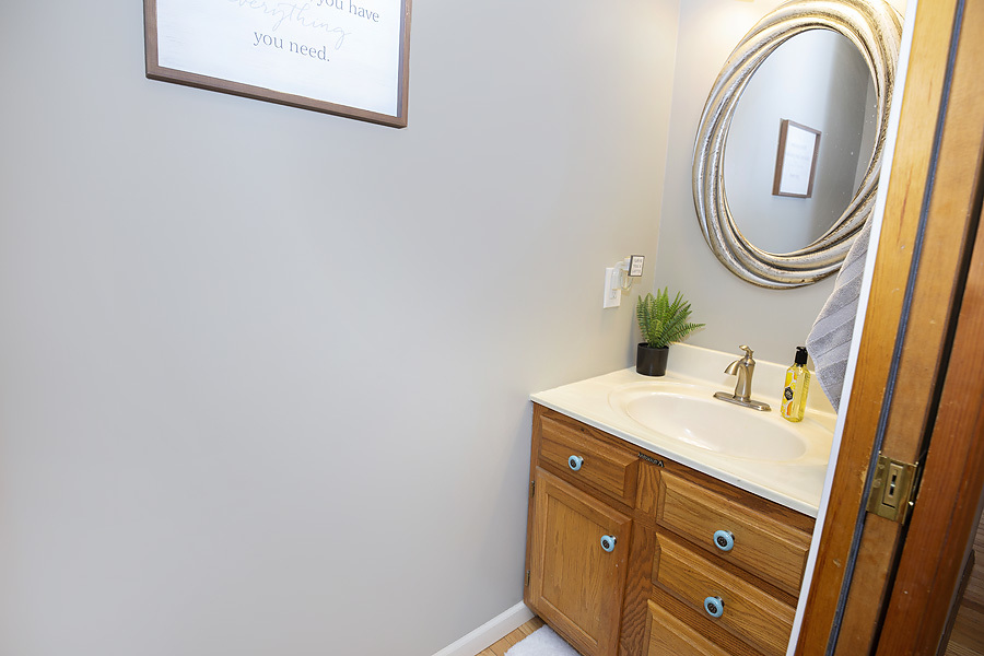 709 Landau Lane Normal, IL 61761 - Photo 15 of 44 a bathroom with a sink and a mirror