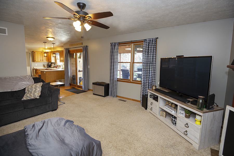 709 Landau Lane Normal, IL 61761 - Photo 17 of 44 a living room with furniture and a flat screen tv