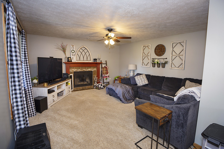 709 Landau Lane Normal, IL 61761 - Photo 18 of 44 a living room with furniture and a flat screen tv