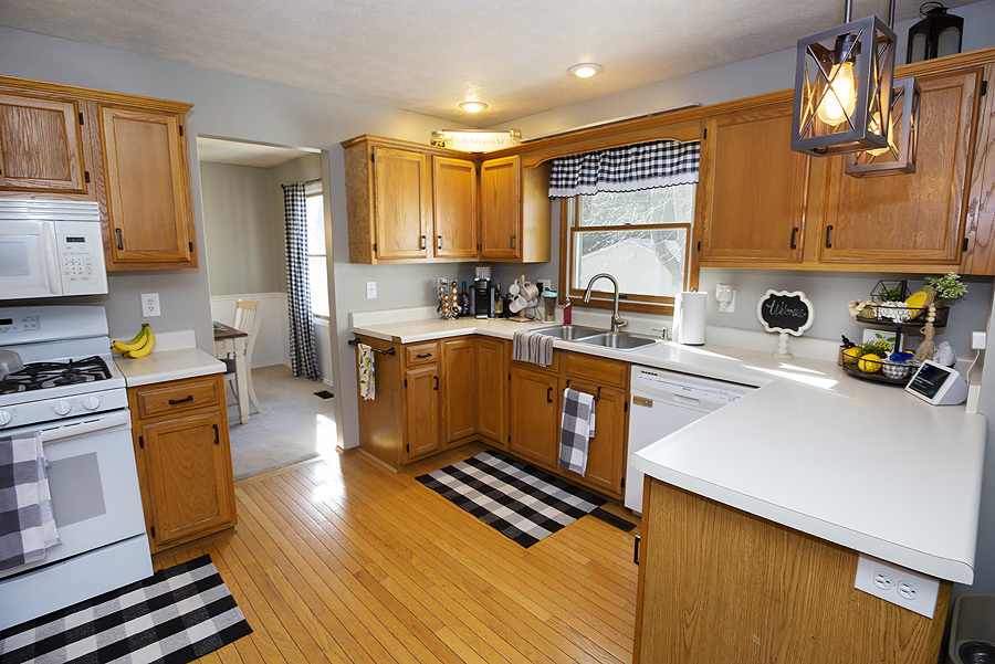 709 Landau Lane Normal, IL 61761 - Photo 22 of 44 a kitchen with wooden cabinets and stainless steel appliances