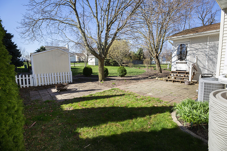 709 Landau Lane Normal, IL 61761 - Photo 23 of 44 a view of a garden with a fountain