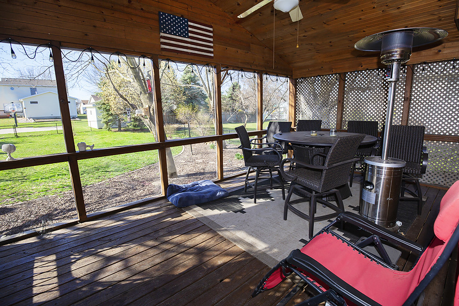 709 Landau Lane Normal, IL 61761 - Photo 25 of 44 a living room with furniture and a floor to ceiling window