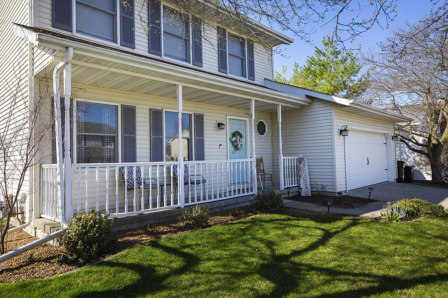 709 Landau Lane Normal, IL 61761 - Photo 3 of 44 a view of a house with a small yard plants and large tree