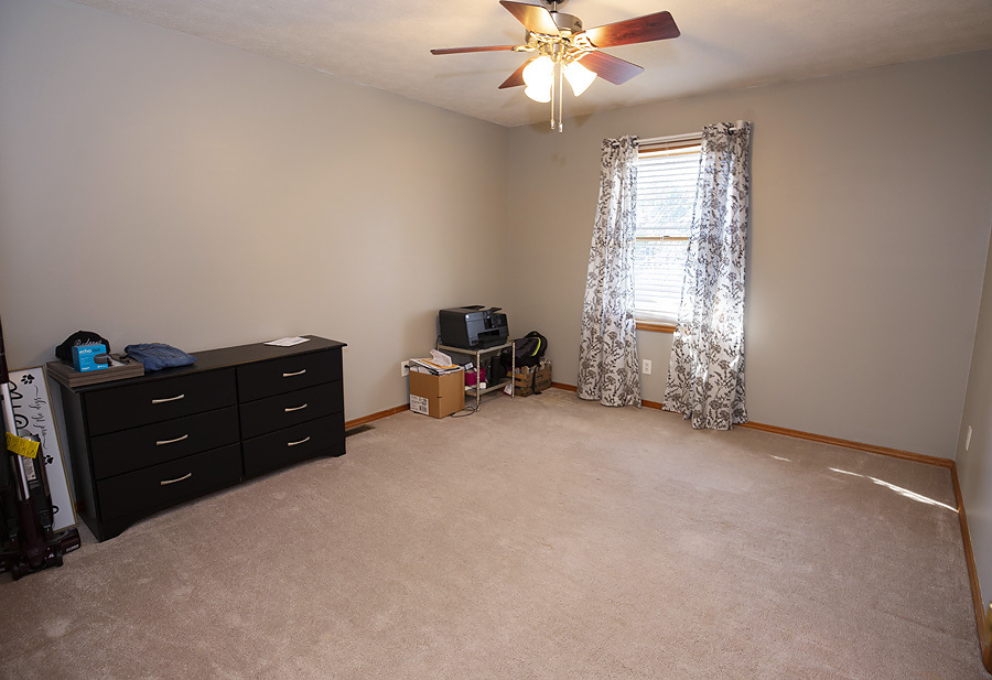 709 Landau Lane Normal, IL 61761 - Photo 31 of 44 an empty room with a window and a ceiling fan