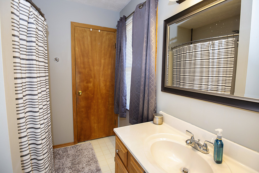 709 Landau Lane Normal, IL 61761 - Photo 33 of 44 a bathroom with a sink and a mirror