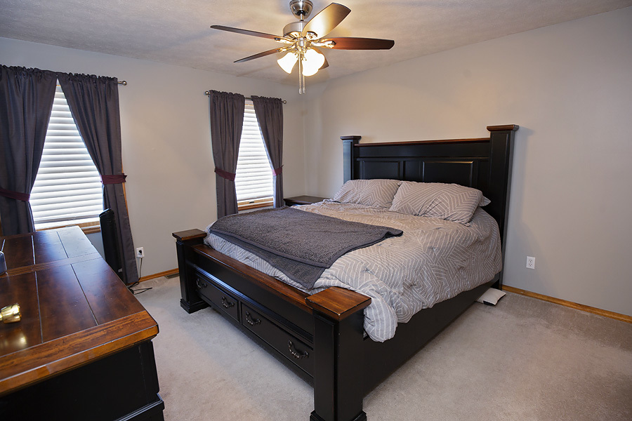 709 Landau Lane Normal, IL 61761 - Photo 34 of 44 a bed sitting in a bedroom next to a window