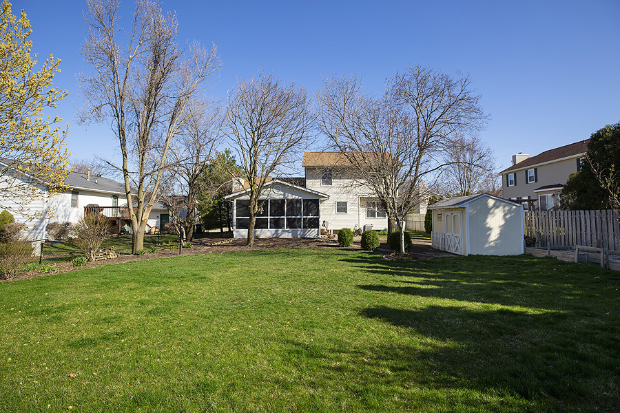 709 Landau Lane Normal, IL 61761 - Photo 5 of 44 a front view of a house with a garden