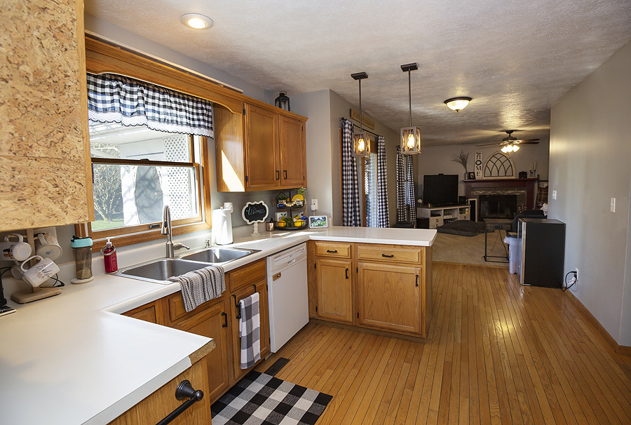 709 Landau Lane Normal, IL 61761 - Photo 9 of 44 a kitchen with stainless steel appliances granite countertop a sink stove and wooden cabinets