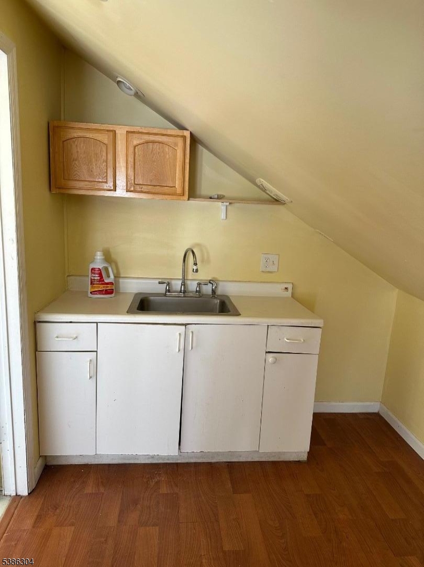 224 Ward Place South Orange, NJ 07079 - Photo 3 of 9 a utility room with a sink a microwave and cabinets