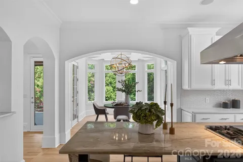 a kitchen with a table and chairs in it