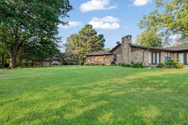 a house view with garden space
